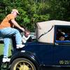 Mike Welch jumps into the rumble seat for a ride