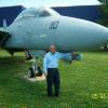 Fred Meiner beside the Grumman F-14D Tomcat.  Fred worked on the F-14 program.
