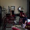 Patty Johnson viewing the carriages in the carriage house.