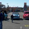 After the meeting, the group moves to the parking lot to talk Studebaker