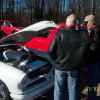 Herman Gantt talks to Linwood Crawford in front of his 1953 Studebaker custom