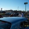 Rocco, Betsy Young, Martin Pajka, Linwood Melton, and Maze Melton discussing Studebaker with a fan