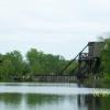 Old railroad bridge crossing canal.