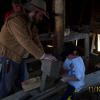 Mike Welch's grandson Jake takes a turn using the Draw Knife.