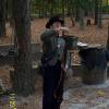 A reenactor provides the group with a rifle drill demonstration 